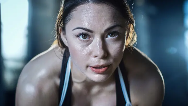 Woman sweating while exercising