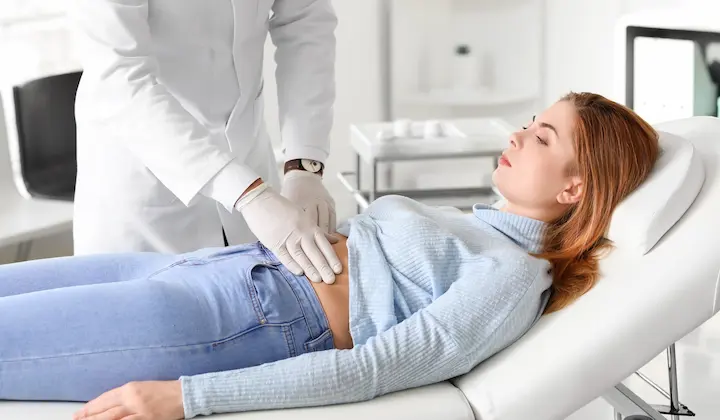 Woman suffering from diarrhoea