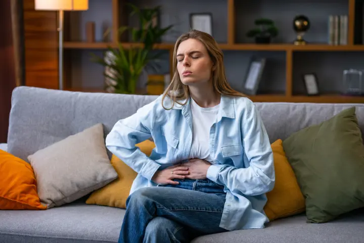 Woman With Diarrhoea Holding Belly